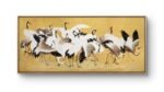 an elegant traditional-style painting of a group of cranes set against a warm golden background